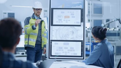 Aufkleber - On a Meeting Chief Industrial Engineer Wearing Safety Jacket, and Hardhat Reports to a Group of Specialists, Managers, Uses Interactive Digital Whiteboard to Show New Eco Friendly Engine Technology