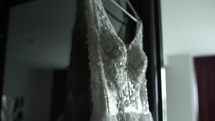 Poster - wedding dress hanging on the wall