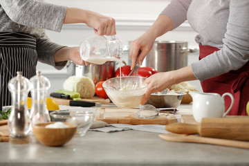 Wall Mural - Hands in kitchen making meal.Table of free space for your decoration and fresh vegetables. 