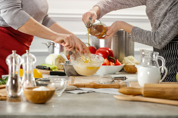 Wall Mural - Hands in kitchen making meal.Table of free space for your decoration and fresh vegetables. 