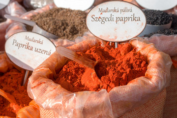 Detail of the stall selling spice, farmers street food market at Naplavka, Prague, Czech Republic. Hungarian spicy hot Szegedi paprika and smoked paprika.