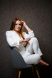 © Дмитрий Ткачук - beautiful tanned girl in a white suit posing beautifully