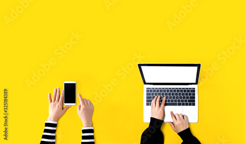 Fotografía People working together with laptop and phone