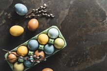 Easter Background With Space For A Text. Natural Dyed Easter Eggs On Dark Stone Background.