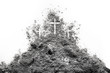 © domagoj8888 - Three cross on the Golgotha hill as Good Friday, Easter, Ash Wdnesday or Lent period drawing in ash or dust as passion of Jesus Christ nad holiday concept