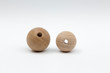 two wooden balls with hole