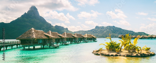 Bora Bora French Polynesia luxury hotel resort overwater bungalow suites in Tahiti, Honeymoon travel destination header panorama background Poster Mural XXL