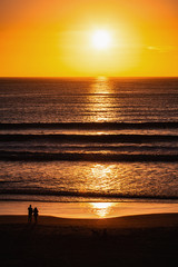 couple at sunset on shore