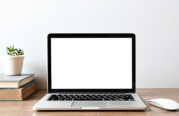 blank screen Modern laptop computer with mouse,Smart phone and Succulent on wood table in office view backgrounds
