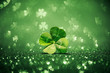 Lucky four leaf clover surrounded by sparkling shamrock shapes