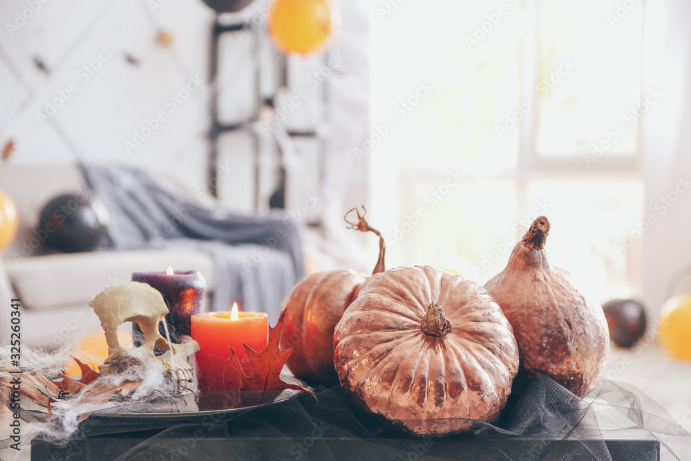 Decor for Halloween party on table in room