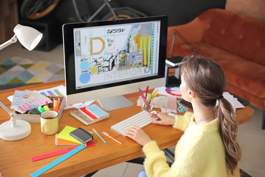 Female interior designer working in office