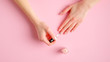 © photoguns - Woman giving herself elegant manicure applying polish on nails at home. Beauty treatment and hand care