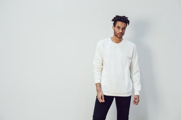 African american man wearing white blank sweatshirt. Mock-up.