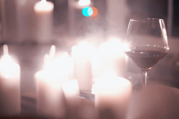 Wall Mural - red wine glass serving / romantic dinner in the interior of the restaurant, a table served with a glass of grapes wine