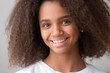 Headshot portrait of african american teen girl looking at camera