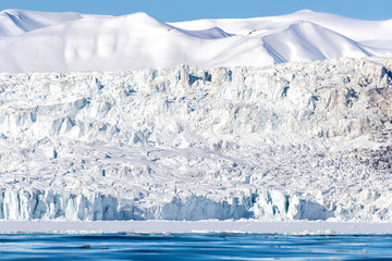 Wall Mural - glacier and pristine snow covered mountains in nordfjorden, svalbard.