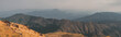 Panorama scenic mountain peaks and ridges stretching during the evening. , Golden grass moving on wind. At Mulayit Taung in Myanmar. is soft focus.