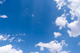 Fototapeta Na sufit - The blue sky with moving white clouds. The most of clouds are beautiful color and shade, suitable for use as background image.