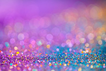 Decoration Twinkle Glitters Background, Abstract Blurred Backdrop With Circles,modern Design Overlay With Sparkling Glimmers. Blue, Purple And Golden Backdrop Glittering Sparks With Glow Effect