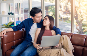 A couple is sitting in living room