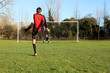 soccer player taking a penalty kick