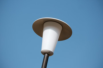 Street lamp with sky in the background