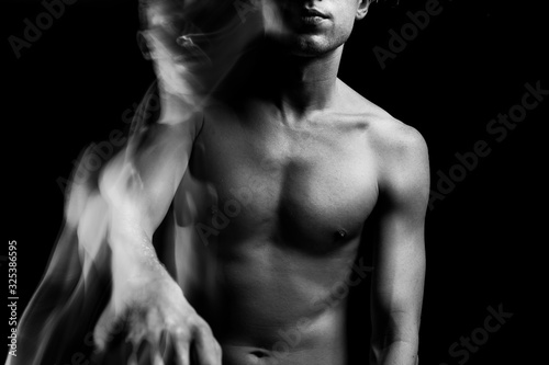 Naked chest and lips of young sporty man. Artistic Beautiful fuzzy mystical mysterious ambiguous original conceptual profile side portrait of young blonde naked man on a black background. Black white