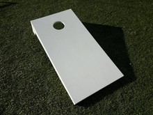 White Board With Hole For Beanbag Toss On Grass