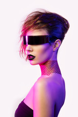 Colorful portrait of a young woman wearing futuristic glasses