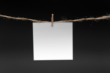 Blank Paper, Hanging On Rope By Pin Against Black Background, Concept, Office