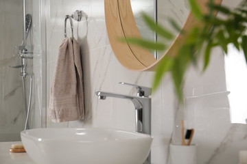 Poster - Bathroom interior with mirror, countertop and soft towel on wall