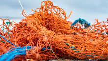 Fishing Nets From Industrial Fishing On The Beach As Waste
