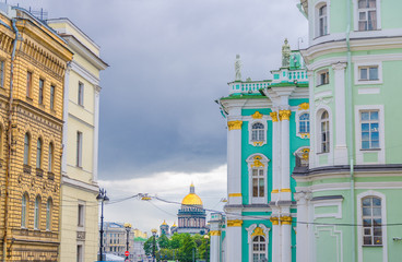 Wall of The State Hermitage Museum building, The Winter Palace and Saint Isaac's Cathedral or Isaakievskiy Sobor museum background, Saint Petersburg Leningrad city, Russia