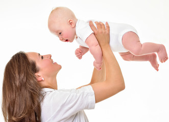 Wall Mural - Mother and baby playing and smiling. Happy family.