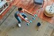 © Valerii Apetroaiei - Woman doing exercises at home.