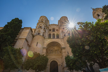 Walking Malaga old town streets. View of Cathedral of Incarnation exterior walls