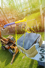 Canvas Print - Forklift on preparing to raise construction with risen telescopic boom in jacuzzi.