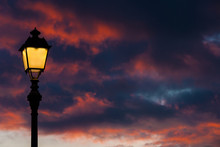 Old Fashioned Street Lamp Against Beautiful Sunset Sky And Colorful Clouds (with Copy Space)