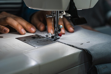 Woman using sewing machine