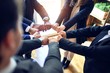 © Krakenimages.com - Group of business workers standing on a circle doing symbol with fists together at the office.