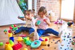 © Krakenimages.com - Adorable toddlers playing meals using plastic food and cutlery toy at kindergarten