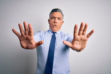 Sticker - middle age handsome grey-haired business man wearing elegant shirt and tie doing stop gesture with h