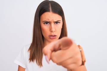 Poster - Close up of beautiful and young brunette woman standing over isolated white background pointing with finger to the camera and to you, hand sign, positive and confident gesture from the front