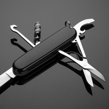 Multipurpose Folding Knife On A Black Background. Swiss Army Knife