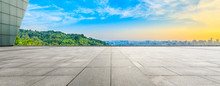 Wide Square Floor And City Skyline With Green Mountain At Sunrise In Hangzhou,China.
