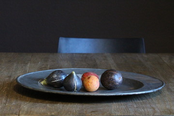 antique pewter plate with fruit