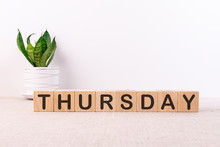The Word Thursday On Wooden Cubes. Weekday Concept.