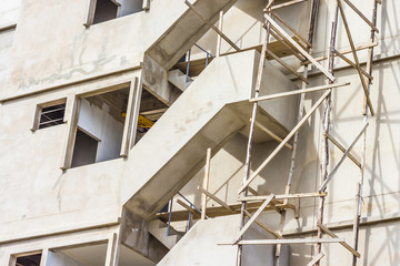 Close up Workers industrial bricklayer installing bricks is under construction, remodeling, renovation, extension, restoration and reconstruction.