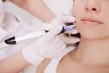 Fototapeta  - Cropped close up of unrecognizable woman getting mesotherapy procedure at beauty clinic